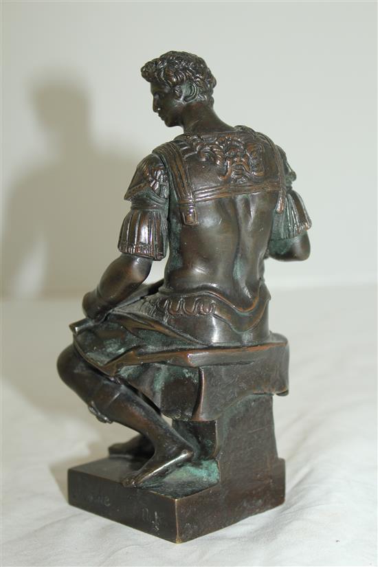 After the antique. A bronze model of a seated Roman soldier, inscribed Michel angelo, 6.5in, on separate marble plinth